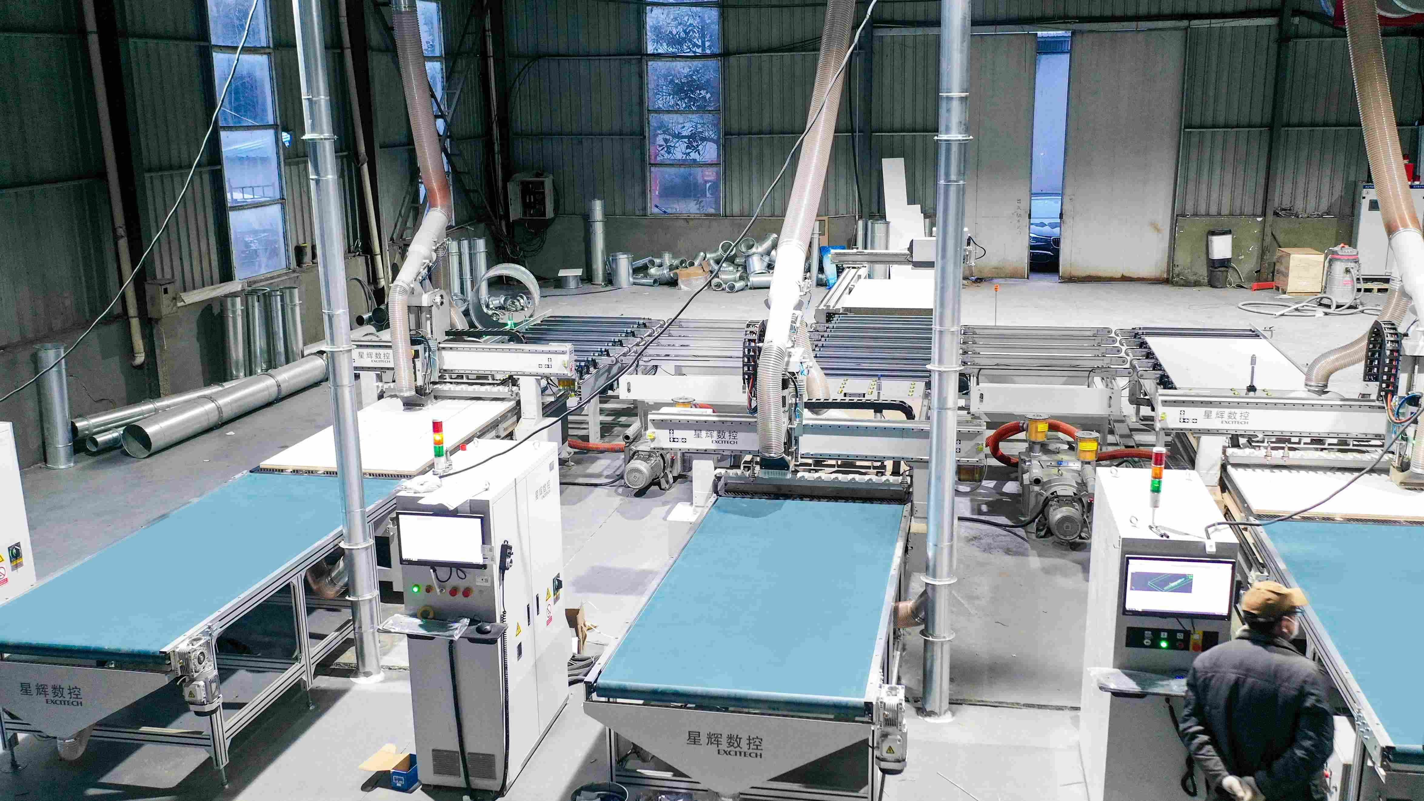 EXCITECH Smart Production: 1 Labeling Machine + 3 Nesting Machines for Optimized Flow